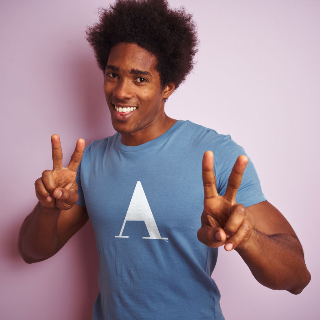 Man wearing mens blue t-shirt with No A-Holes™ hole-less "A" icon design.